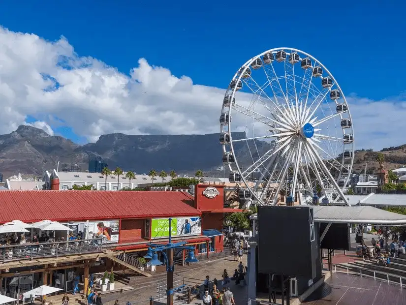 Ferris wheel and vibrant atmosphere at Victoria & Alfred Waterfront.