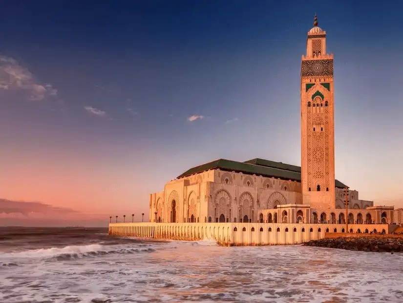 Inner courtyard of a historical building in Casablanca with green-roofed towers.