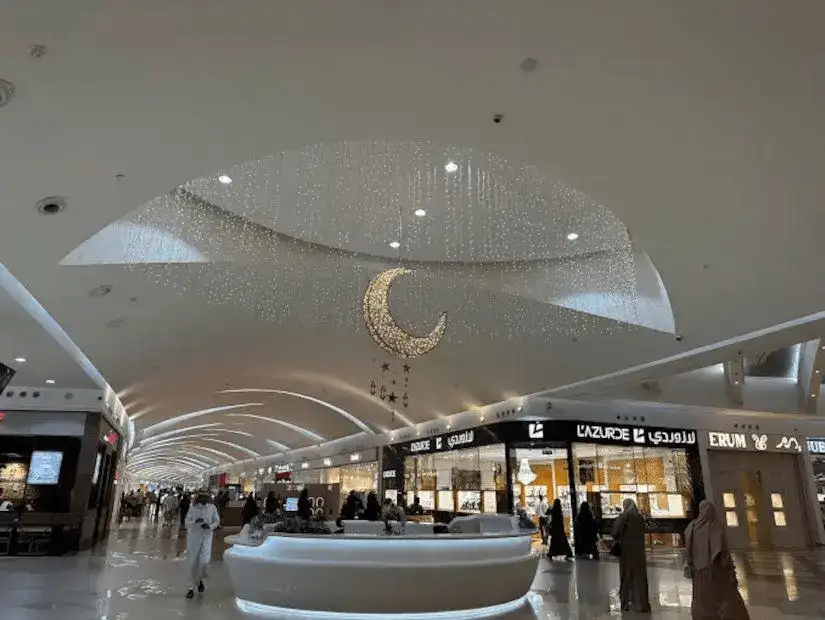 Elegant and spacious interior of Dhahran Mall with decorative lighting.