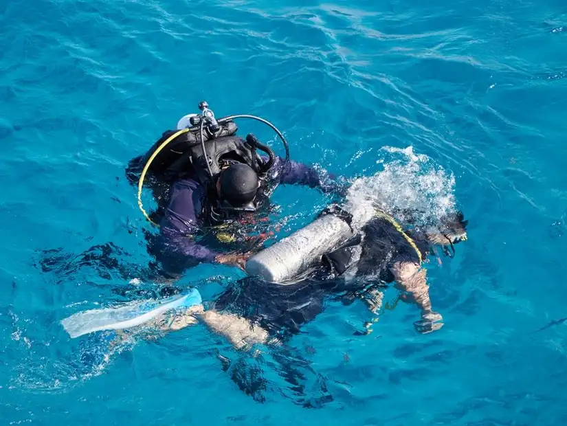 Divers preparing for underwater adventure.