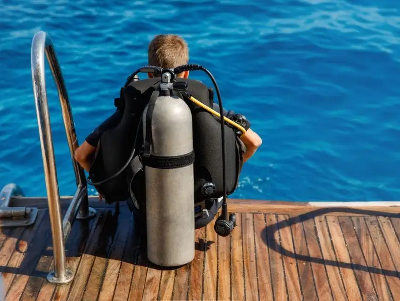 Scuba diver ready to plunge into the ocean.