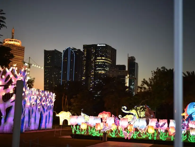 Colorful illuminated displays at Dubai Garden Glow as night falls.