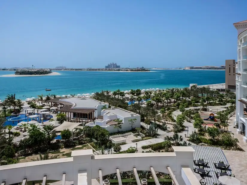 The vibrant pool area at FIVE Palm Jumeirah, offering fun and relaxation with views of the Arabian Gulf.