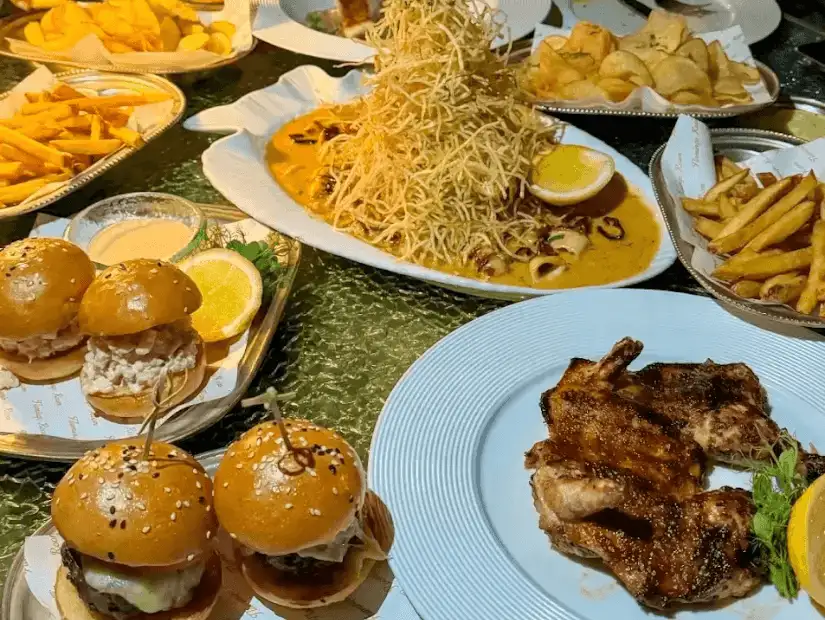 The Flamingo Room by Tasha's, offering a stylish and elegant dining experience with beautifully plated dishes and a chic, modern setting.