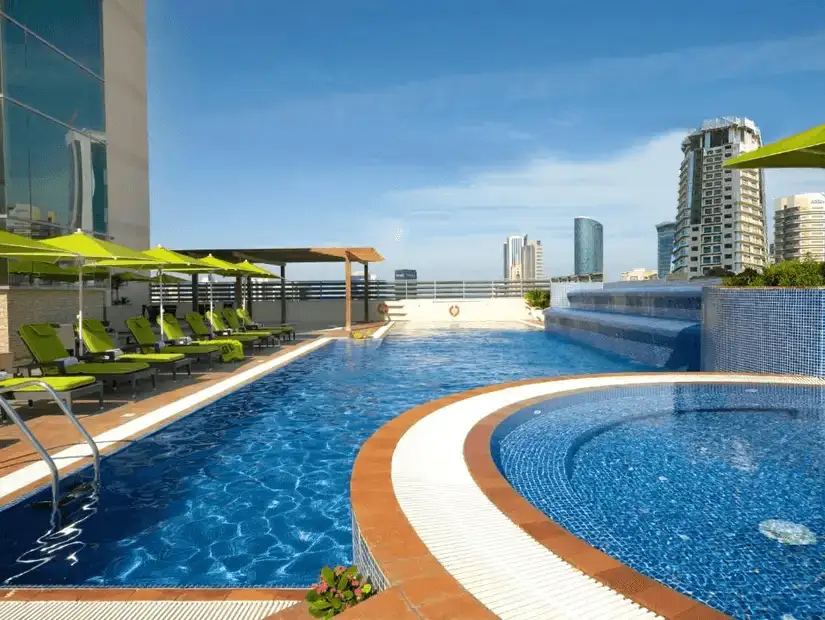 The rooftop pool of Fraser Suites, offering a luxurious escape with views of the modern skyline.