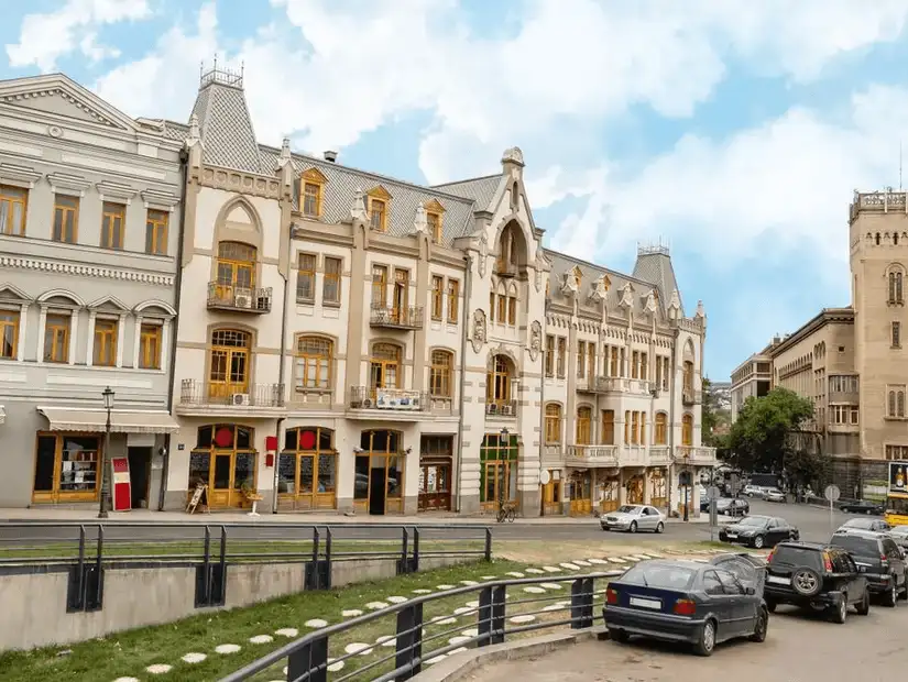 A row of charming European-style buildings in a bustling Georgian town.