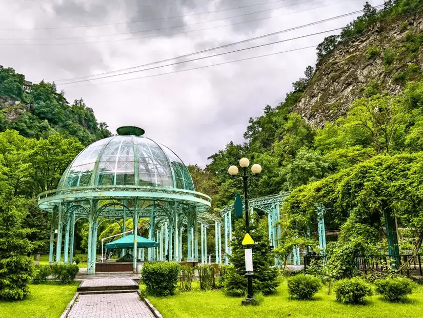 Ancient stone walls surrounded by greenery, blending history with nature.