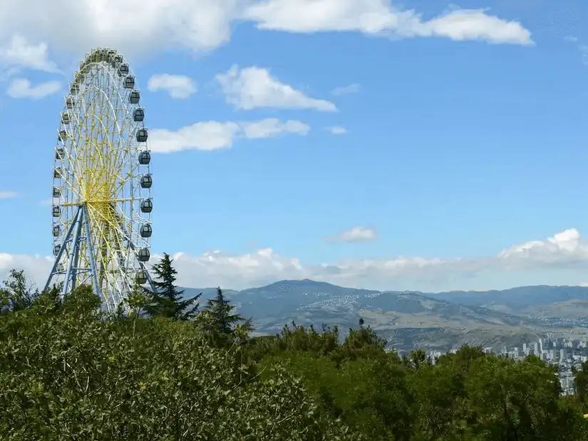 A panoramic Ferris wheel offering breathtaking views of the surrounding landscape in Georgia.