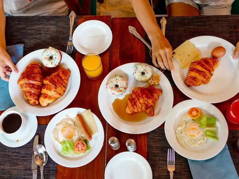 Delicious breakfast spread with pastries and eggs