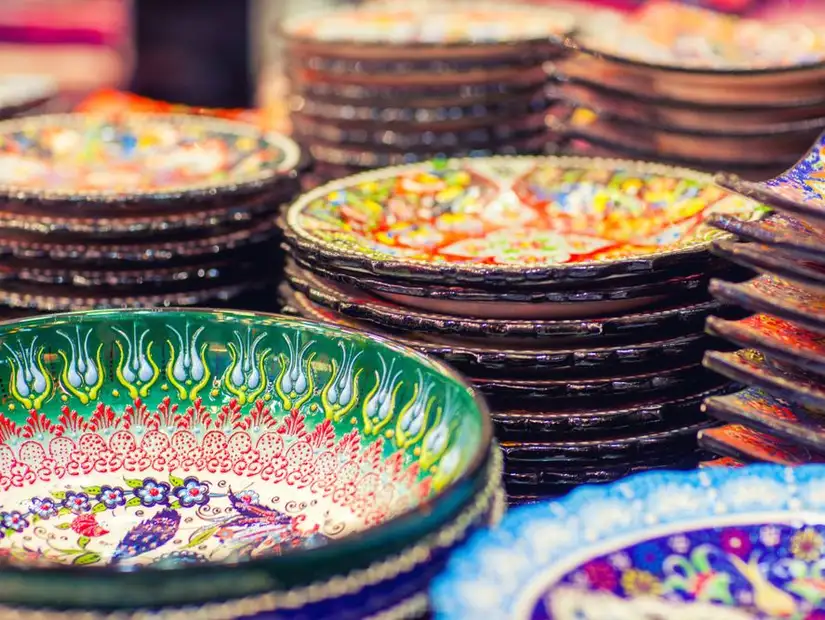 Intricately painted ceramic plates with traditional designs at a local shop.