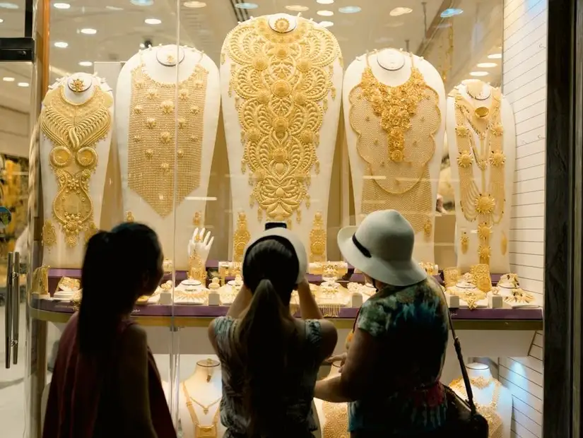 Enthralling onlookers with a dazzling display of elaborate gold jewelry.