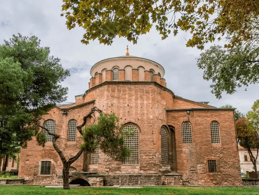 An ancient church with distinct architecture and serene surroundings, located within the historical area of Istanbul.