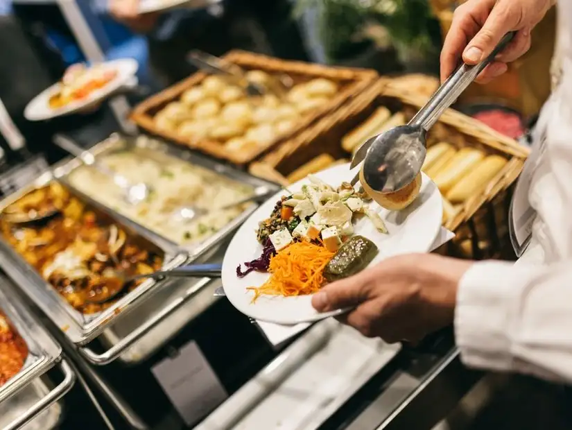 A variety of colorful dishes on a buffet