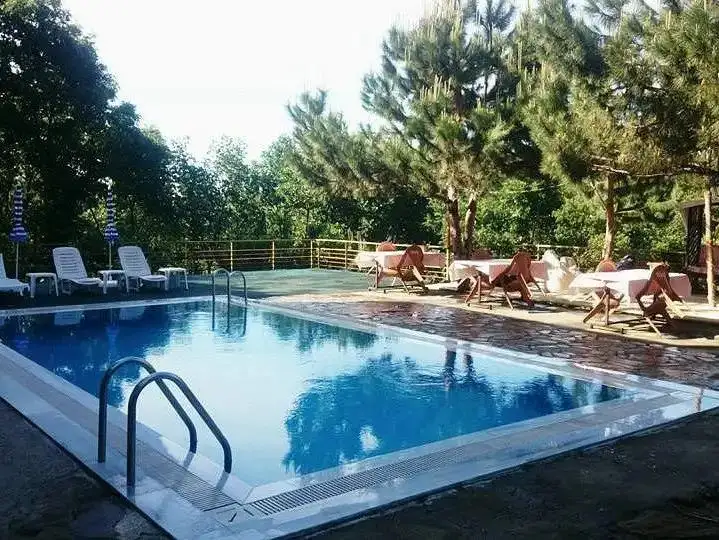 A stylish boutique hotel offering comfort and a scenic view.