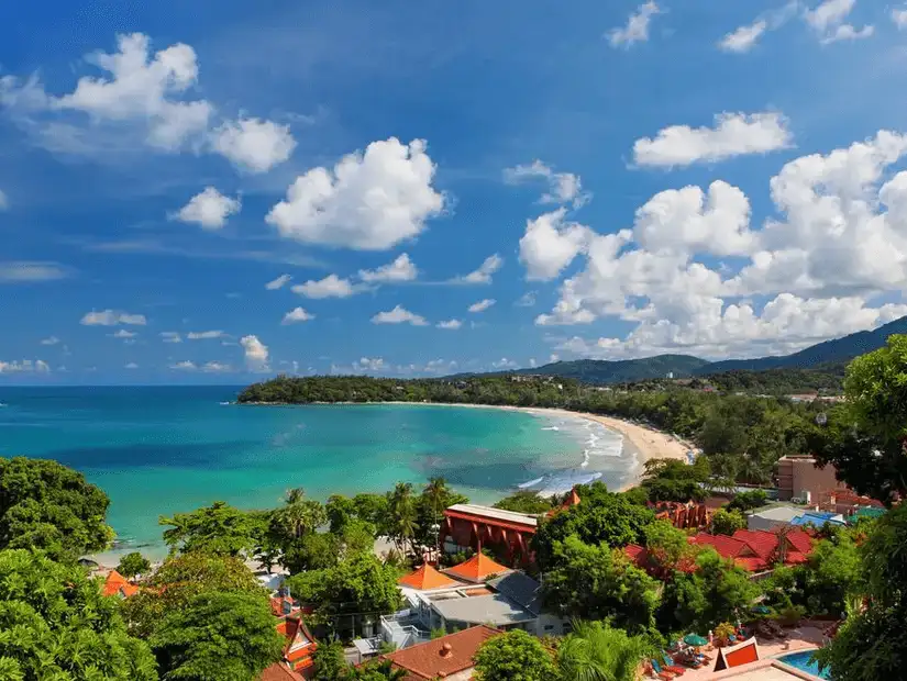 The picturesque shoreline of Kata Beach under a clear blue sky.