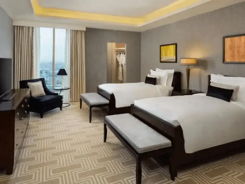 Elegant double room at Kempinski Hotel with modern furnishings.