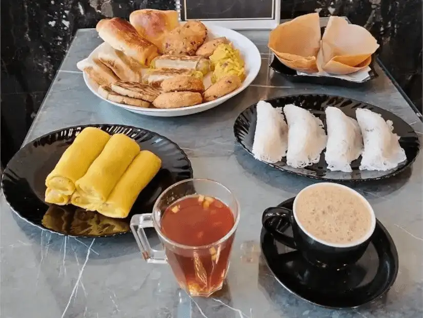 A delicious assortment of pastries, tea, and traditional breakfast delights.