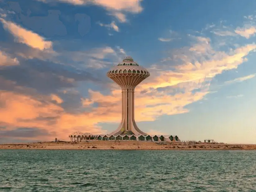 Iconic Khobar Water Tower at sunset with vibrant sky.