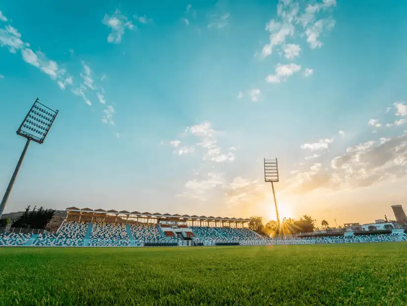 King Saud Stadium basking in the golden light of sunset.