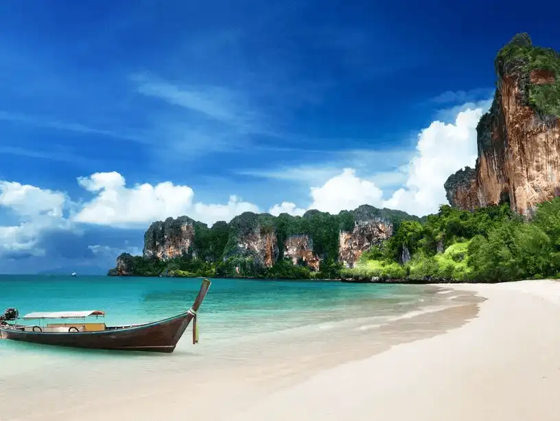 A stunning view of Krabi City with lush mountains and blue waters.