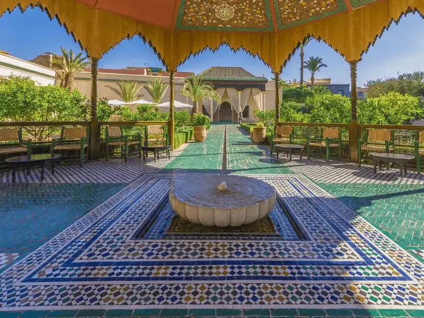 Le Jardin Secret, a serene garden in the heart of Marrakesh, surrounded by lush greenery.