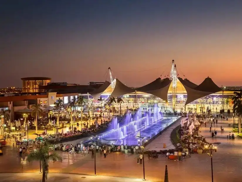 A view of Mall of Arabia showcasing its modern architecture and outdoor fountains.