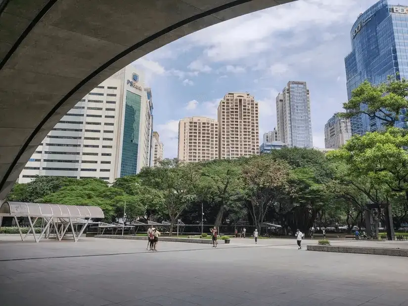 Ayala Triangle Park surrounded by modern architecture and green spaces.