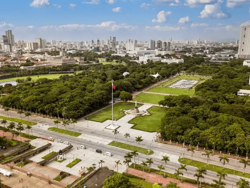 Rizal Park with greenery and city views.