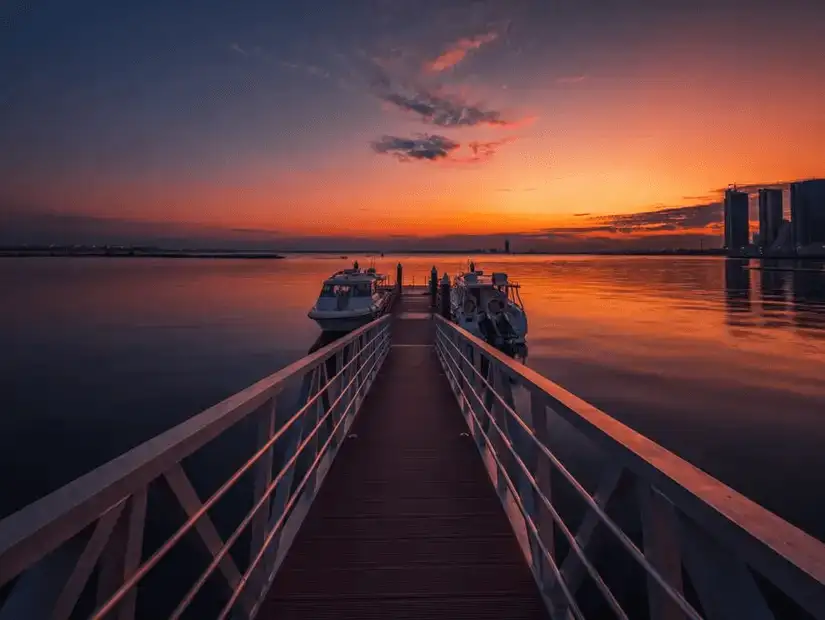 A serene pier at Marina Corniche, offering a perfect view of the sunset.