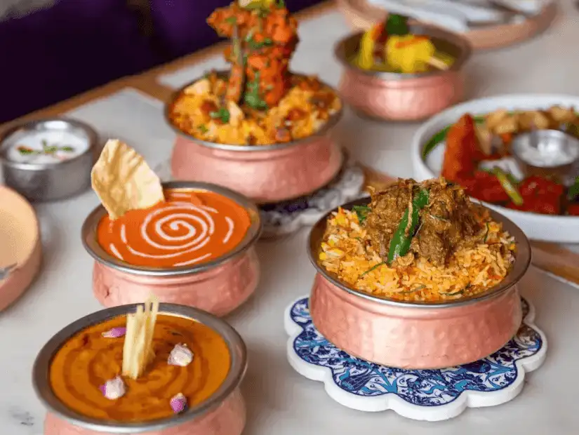 A hearty meat dish with soft rice and a variety of vegetables and seasonings.