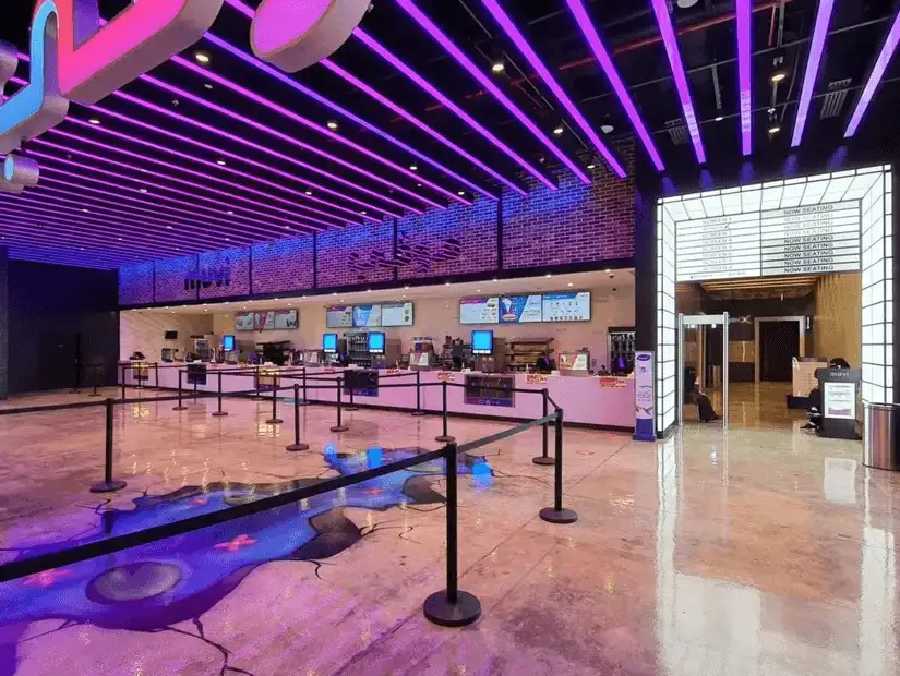 A brightly lit cinema concession area with modern design.