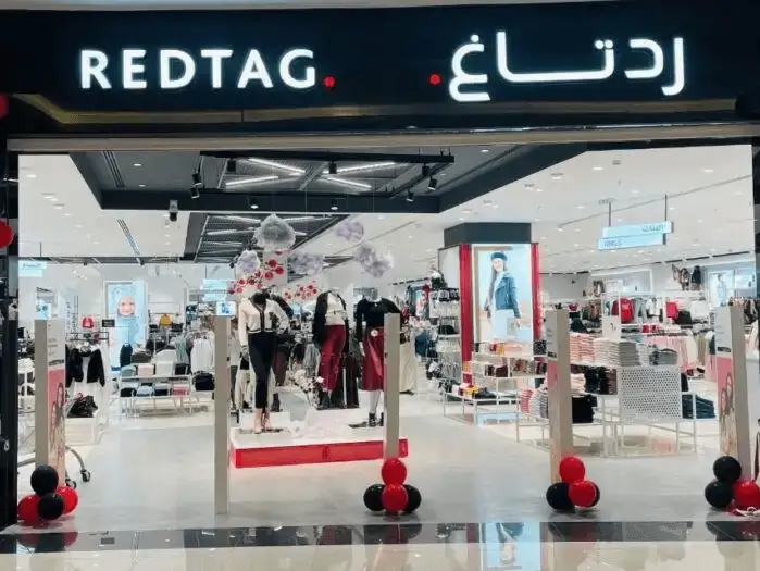 The entrance to a fashion retail store named "REDTAG".