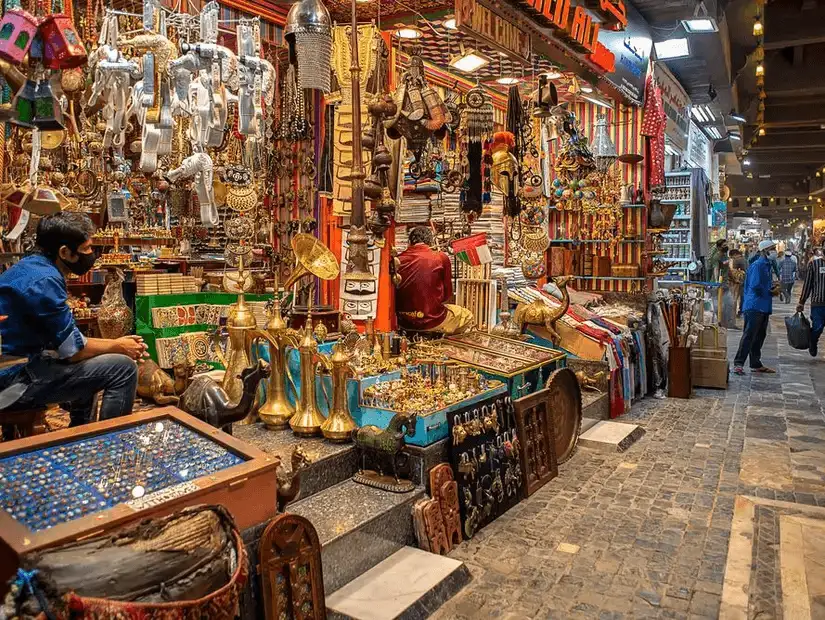 The bustling Muttrah Souq, filled with traditional Omani crafts, trinkets, and vibrant market stalls.