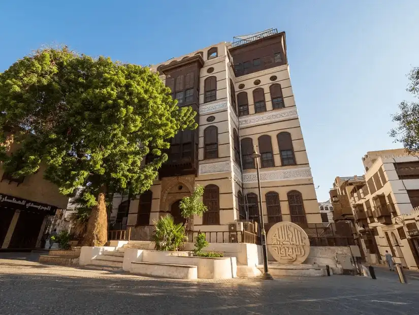 Historic Nassif House Museum surrounded by lush greenery.