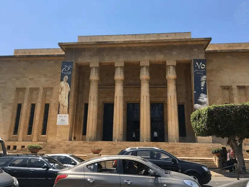 The grand entrance of the National Museum of Beirut, showcasing its majestic stone architecture.