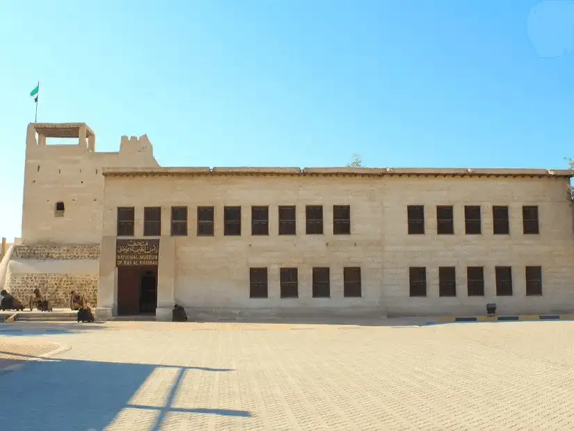 A sand-colored fort with shuttered windows and a flag-topped watchtower houses the emirate’s national museum.