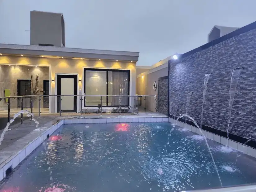 A cozy chalet with a relaxing pool and spacious garden area for outdoor enjoyment.