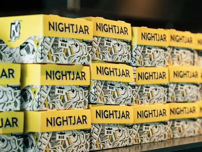 Nightjar coffee packages stacked neatly.