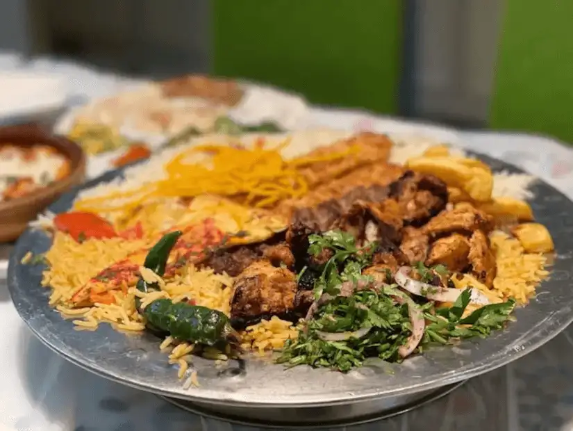 A large platter of traditional mixed grill and rice.