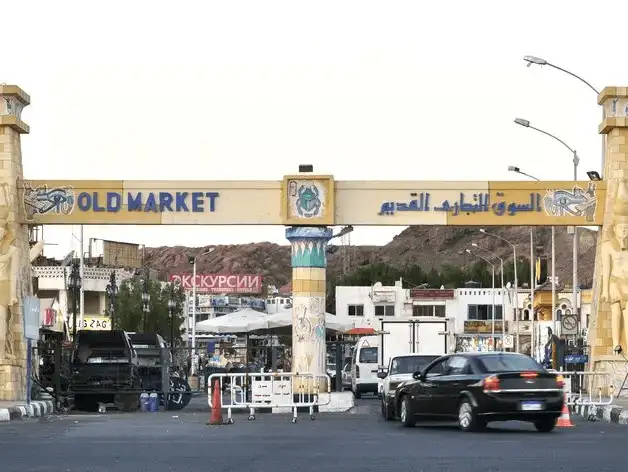 The entrance to the bustling Old Market, where tradition meets modernity amidst a backdrop of cultural heritage.