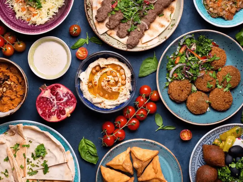 A vibrant display of classic Turkish dishes including kebabs and an assortment of mezze.