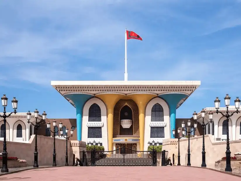 The colorful and iconic Al Alam Palace in Muscat, a symbol of Oman's heritage and royal grandeur.