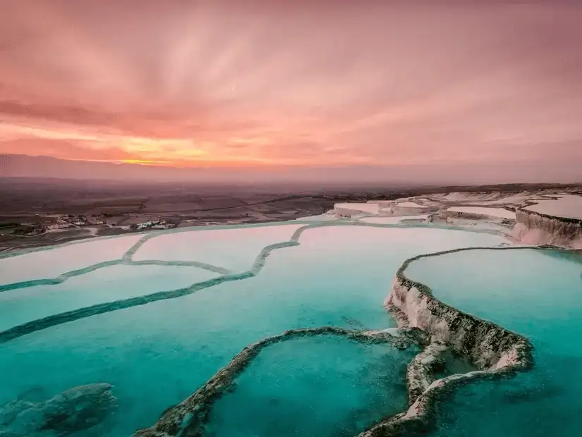 The mesmerizing thermal terraces of Pamukkale during a beautiful sunset.