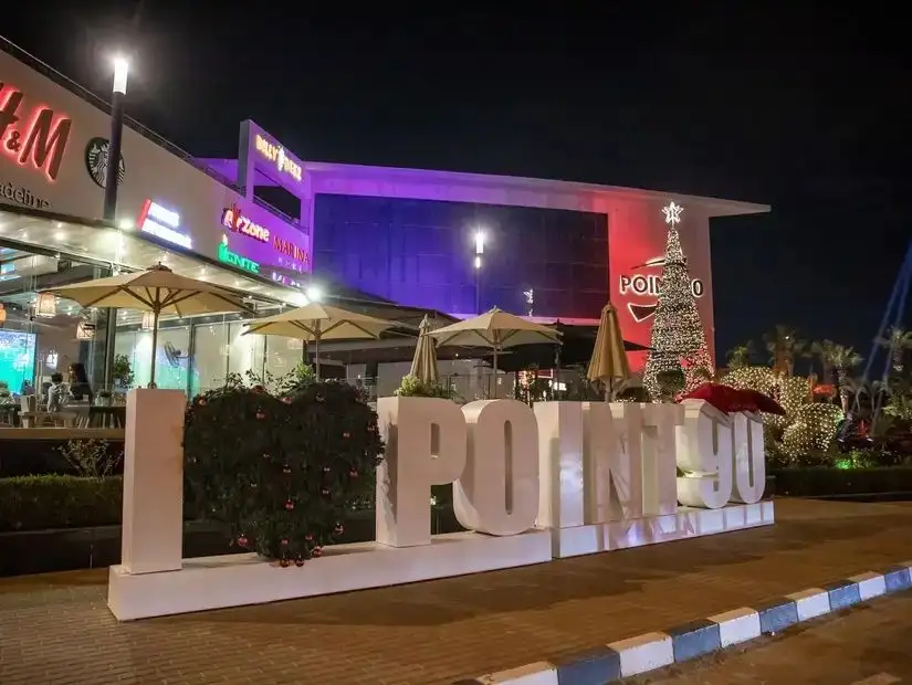 Point 90 Mall with colorful lighting and outdoor seating areas, creating a lively atmosphere.