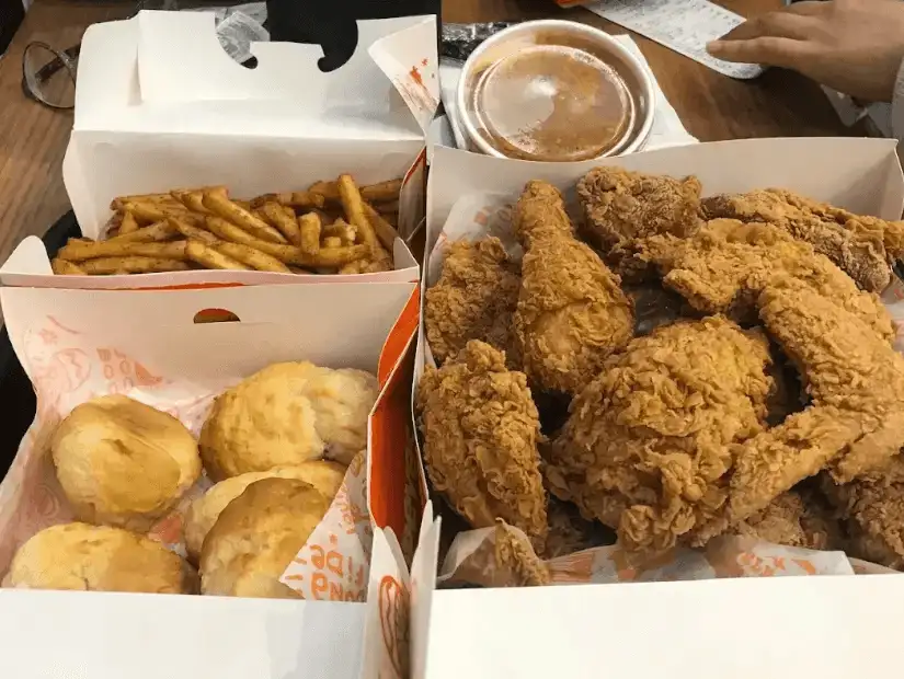 Fried chicken with fries, biscuits, and gravy from Popeyes.