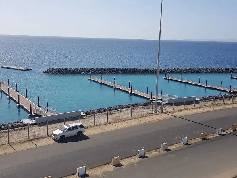 Serene view of a modern, well-organized port with clear blue waters.