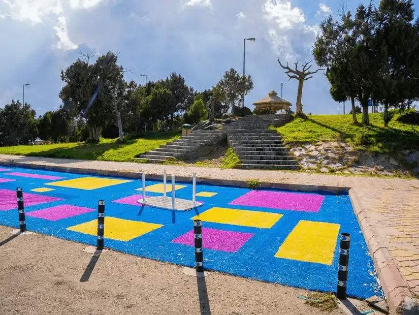 Colorful geometric designs brighten a pathway at Prince Mishari Park.