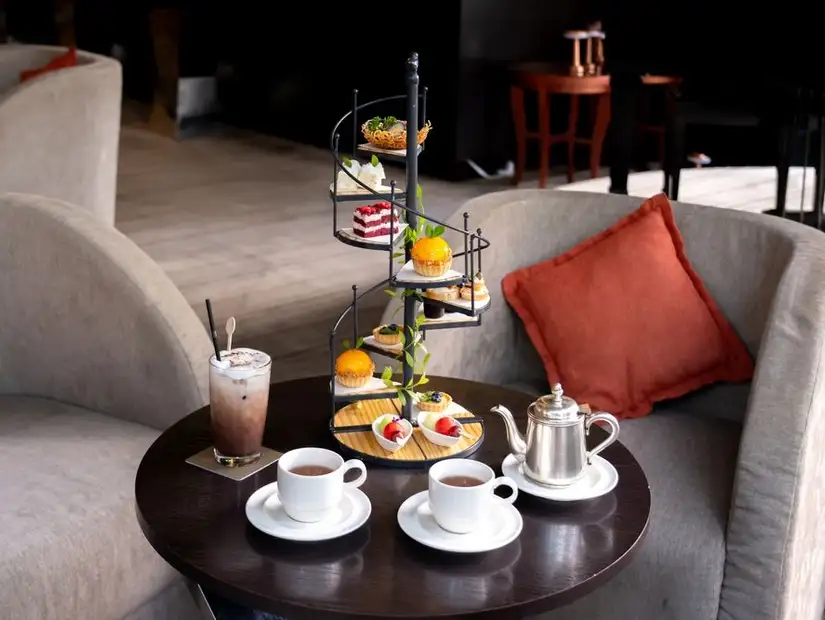 Indulgent tower of treats at Raffles Salon, perfect for a refined afternoon tea experience.