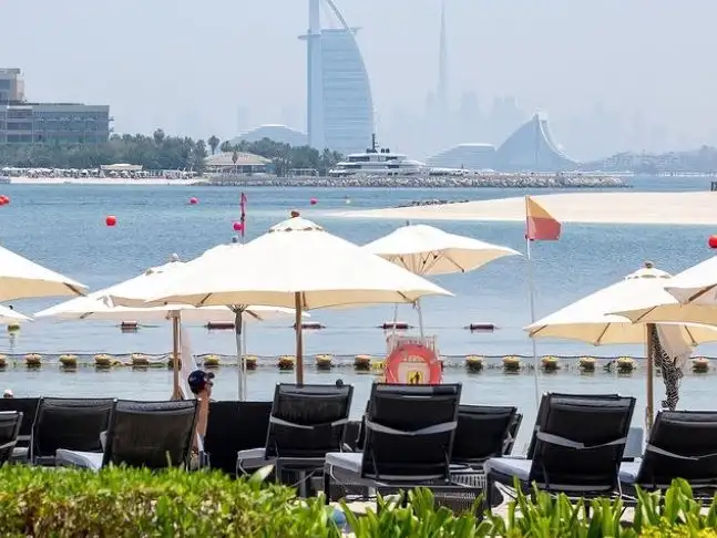 Relaxing at Riva Beach with the iconic Burj Al Arab in the distance.