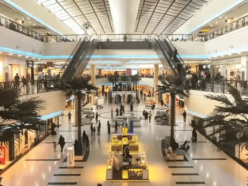 Wide shot of Riyadh Gallery Mall, featuring multiple floors and escalators.